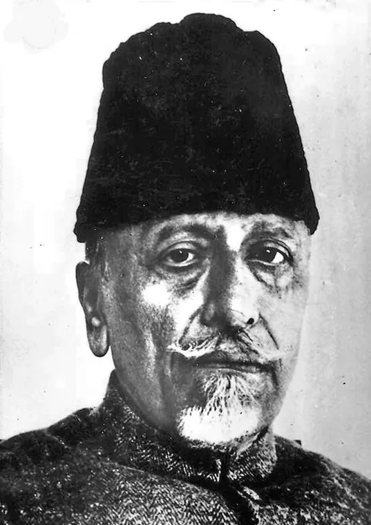 Black-and-white portrait photograph of Maulana Abul Kalam Azad in a tall karakul cap, looking towards the camera.