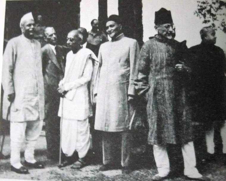 Group photograph of Indian political leaders standing outdoors during a conference at Simla.